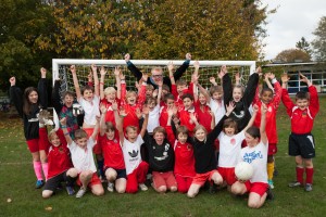 05/11/14 - Radio DJ Chris Evans with children of Weeke Primary School with one of the new football nets he presented to the school. Nine-year-old pupil Tobey Fergusan contacted Chris' radio show after his football team were forced to play using tiny goals. Photo: Ian Hinchliffe